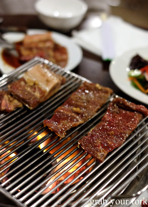 Marinated beef rib on the barbecue grill at Jang Tur Charcoal BBQ Restaurant, Canterbury