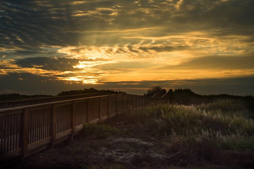 boardwalk contrast sunrise clouds sunrays portaransas texas grass beach