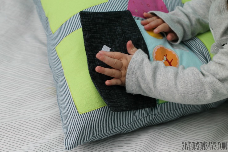 Baby pillow with a sensory flap