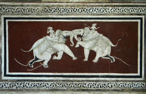 A mural of two elephants fighting on a wall in the Bundi Fort in India