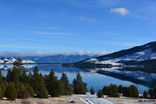 lake snow mountains reflection montana serene flathead