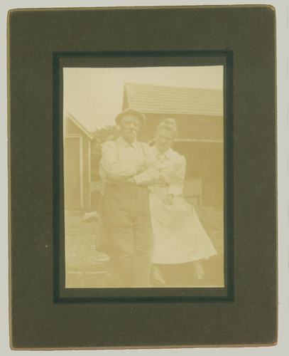 Couple in front of the house