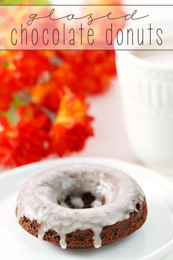 Glazed Chocolate Donut on a white plate with a cup of coffee.