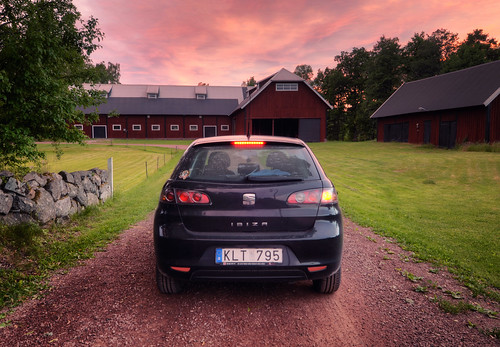 road trees sunset red sky grass car rock metal stone wall clouds barn reflections cloudy sweden seat wheels barns tires dirt ibiza transportation vehicle sverige vignette gravel rya