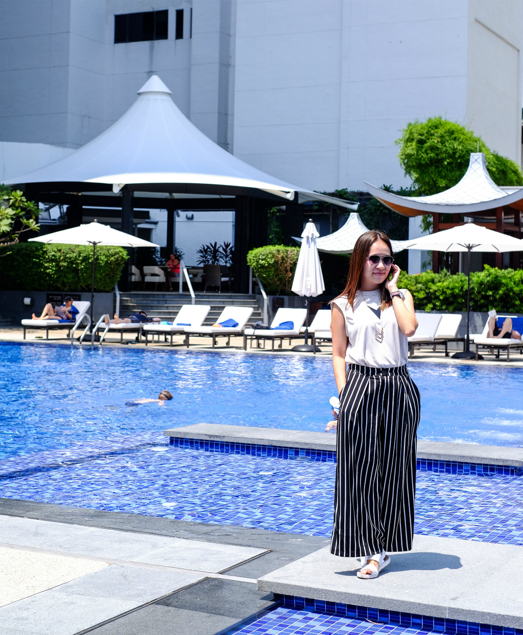 Maureen taking photo at Singapore Marriott Tang Plaza Hotel Pool