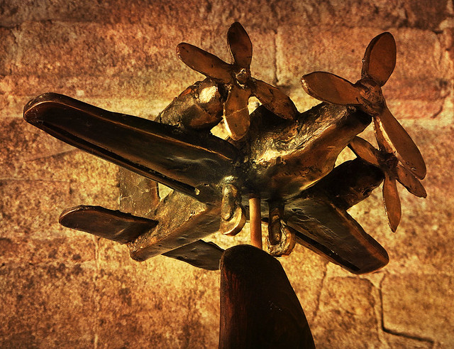 A bronze airplane is part of the art show upstairs at the restored monastery at the Sacred Shore in northern Spain