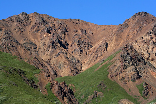 denali national park alaska july 2006 toklat river rest stop blue sky red volcanic hills mountains green tundra layers