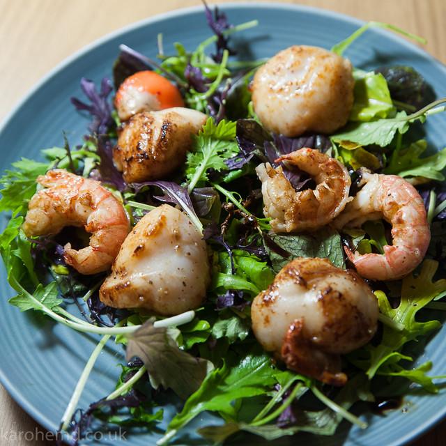 Pan fried scallops and lango tails, dressed leaves