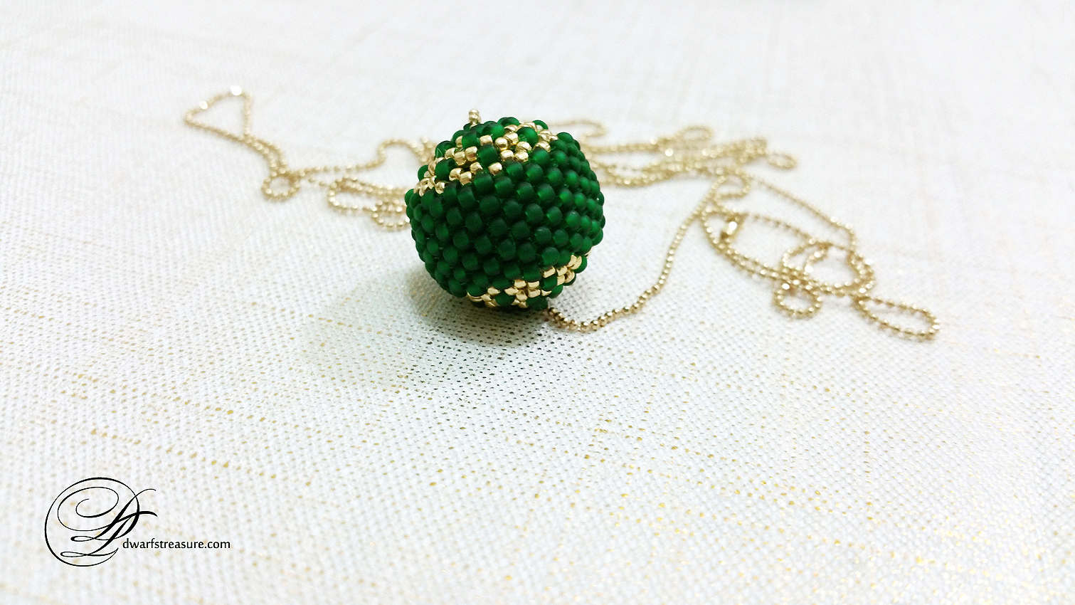 chain necklace with exclusive green and gold beaded ball charm