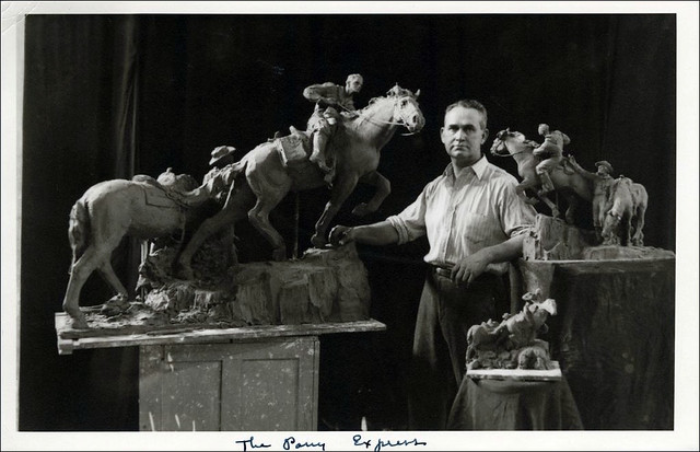 Avard Fairbanks, in his studio with preliminary models of his Pony Express sculpture, circa 1947.