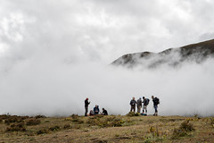 Trekkers and clouds between Lingshi and Chebisa - Thimphu District - Snowman Trek - Bhutan