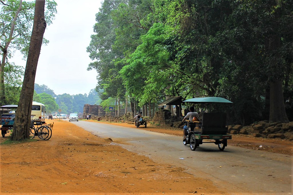Tuk tuk leaving Angkor Thom.