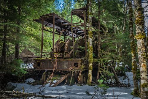 bc britishcolumbia canada spring abandoned colorimage colourimage daytime derelict environmental exterior forest gravel green industrial iron landscape landscapephotography metal noon old orangecolour snow steel tree weather woods vancouverisland cowichanvalley cowichanlake coppercanyon chemainus loggingequipment rust rusty indrustral can pafphotography