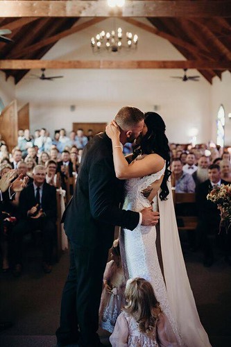 Rachel kissing her groom at the ceremony.