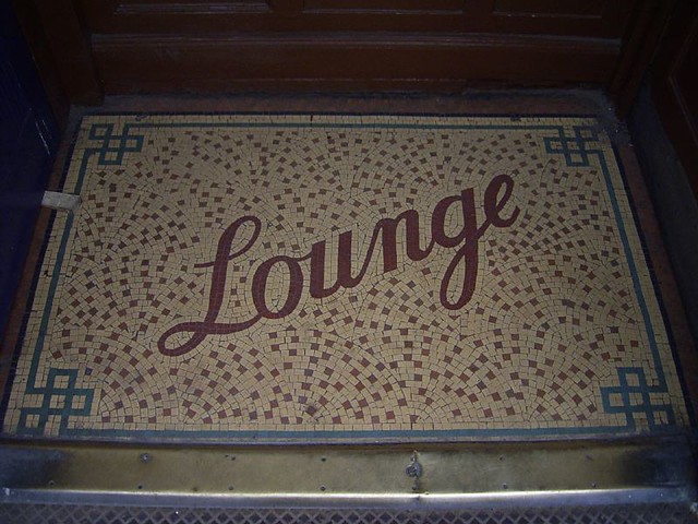 Floor mosaic advertising a pub lounge bar, by Duncan C, via Flickr.