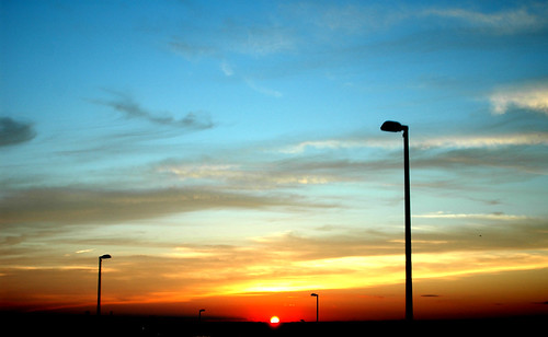 blue sunset sky orange cloud sun landscape lightpole