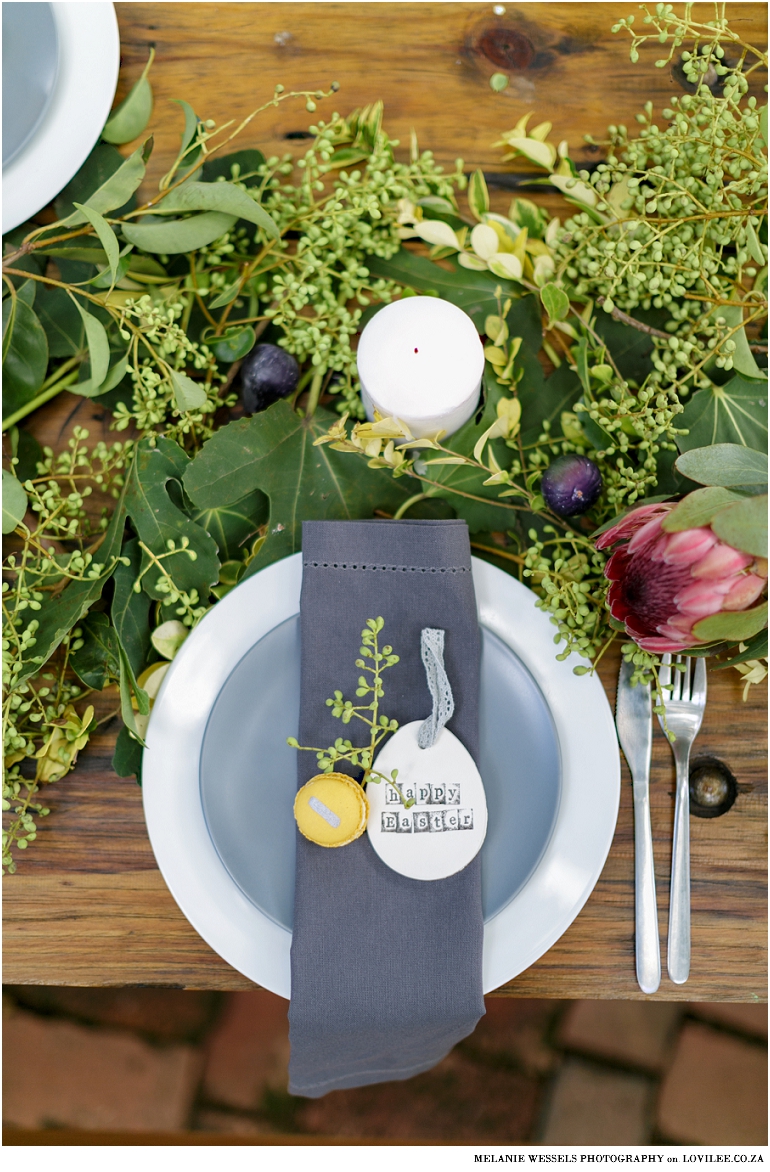 Easter brunch ideas - table setting with air dry Easter eggs and mustard colour macaroons