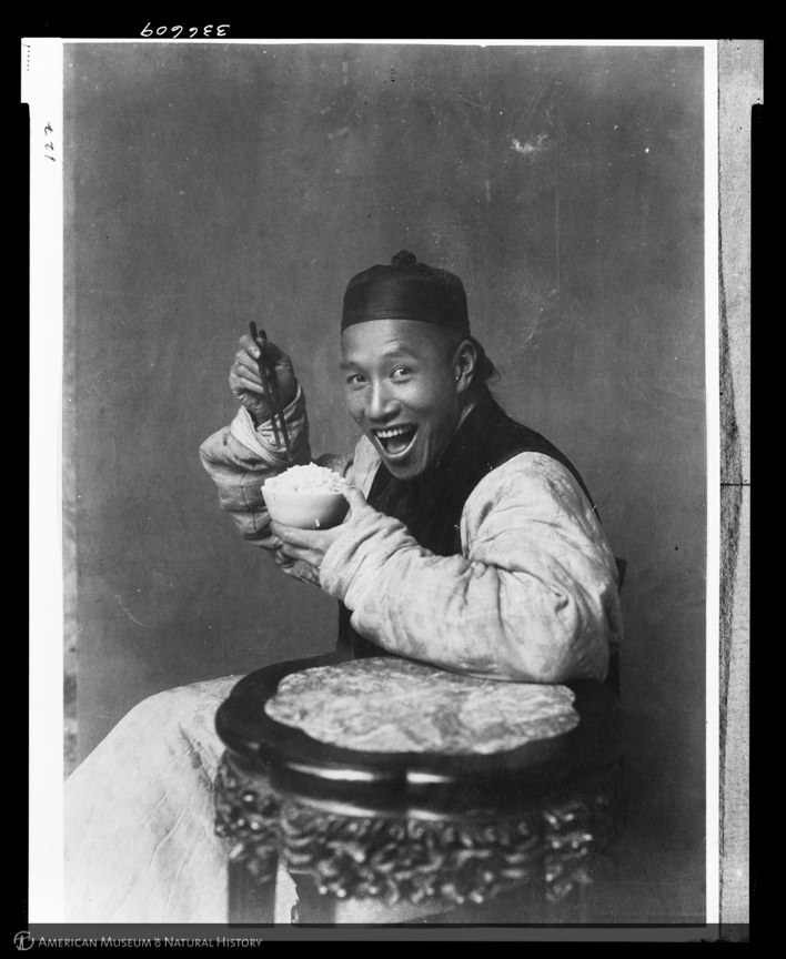 Man eating rice, China, 1901-1904