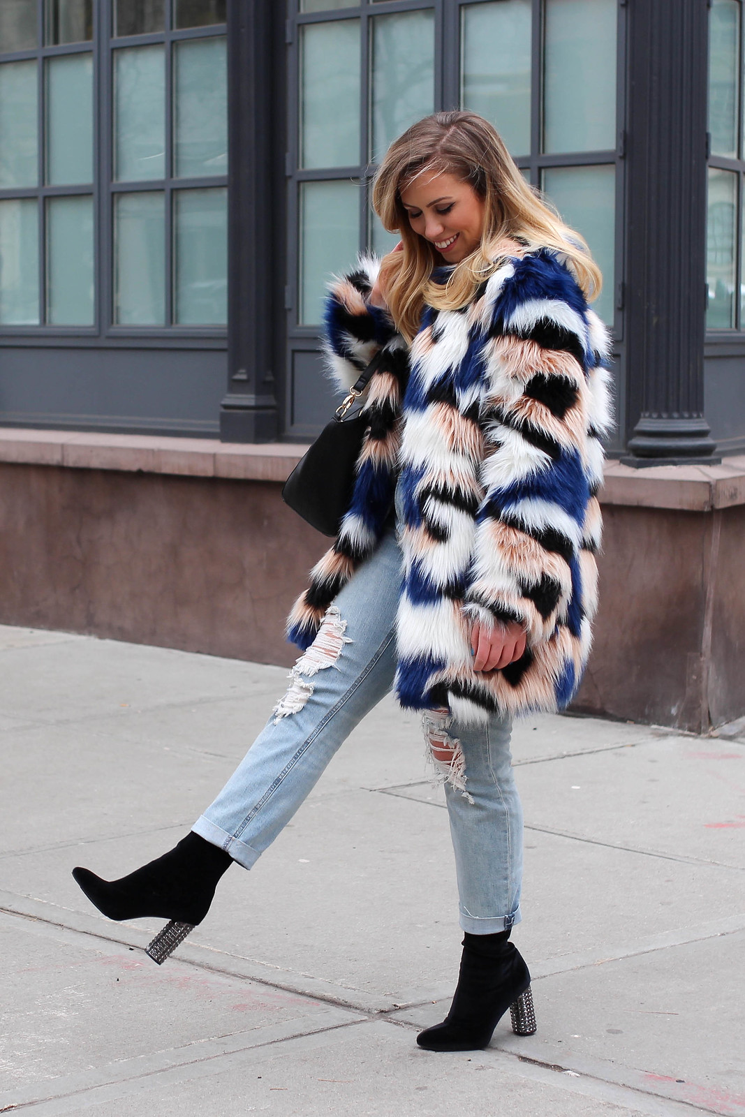 End of Winter Outfit Colorful Fur Coat Light Wash Distressed Jeans Black Sock Booties How to Get Excited by Your Own Wardrobe