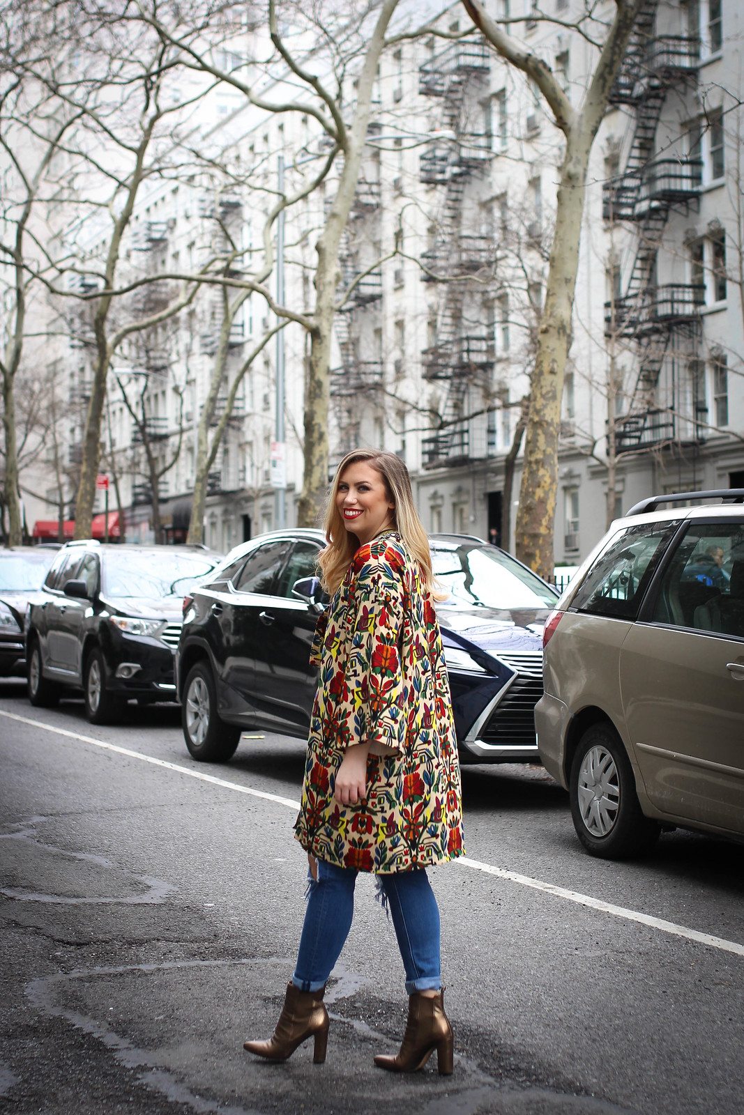 Inexpensive Spring Outfit Idea New York City Fashion Colorful Printed Coat Distressed Denim