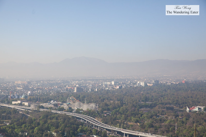 View of west Mexico City from the rooftop of Hyatt Regency (at the helipad) with a hazy view of the Sierra Madre mountains