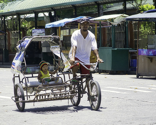 pedicab street buggy baby man child silay city philippines