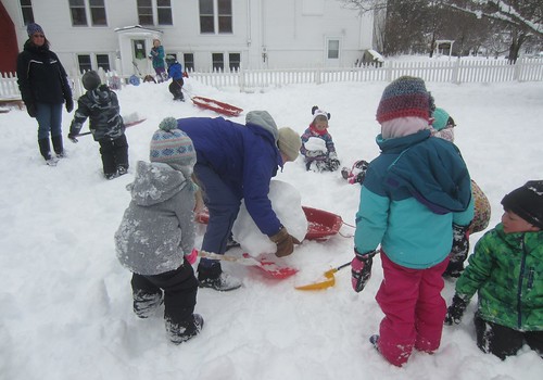loading the snowball on a sled