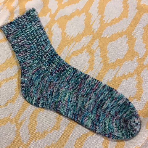 Sandi finished the first half of a sock test knit but needs to wait for the second pattern. The theme is similar but not matching!