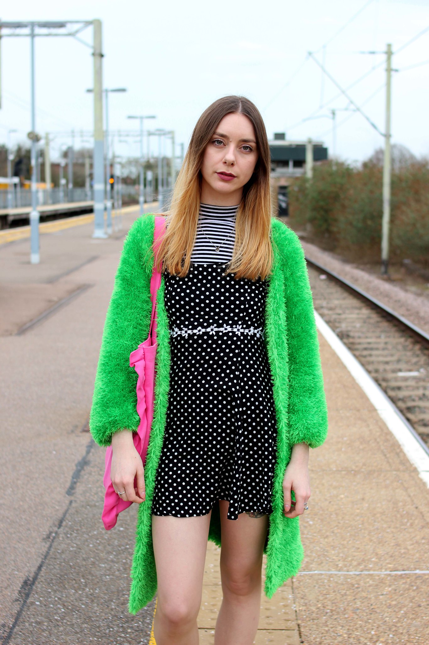 Clashing spots and stripes with a bright green cardigan