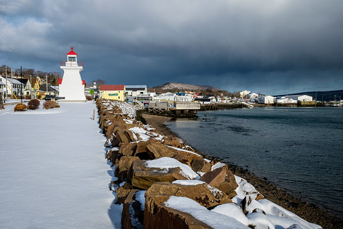 fujixe2 digby novascotia ns canada cans2s winter snow fresh morning light lighthouse harbour water tide tidal fishing boats dark clouds waterfront town