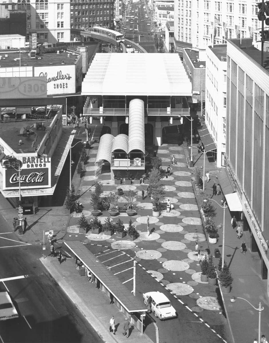 Seattle's original Westlake monorail station/terminal, 1963. The site is now reconfigured, with Westlake Center mall and Westlake Park. The station spanned over Pine Street.