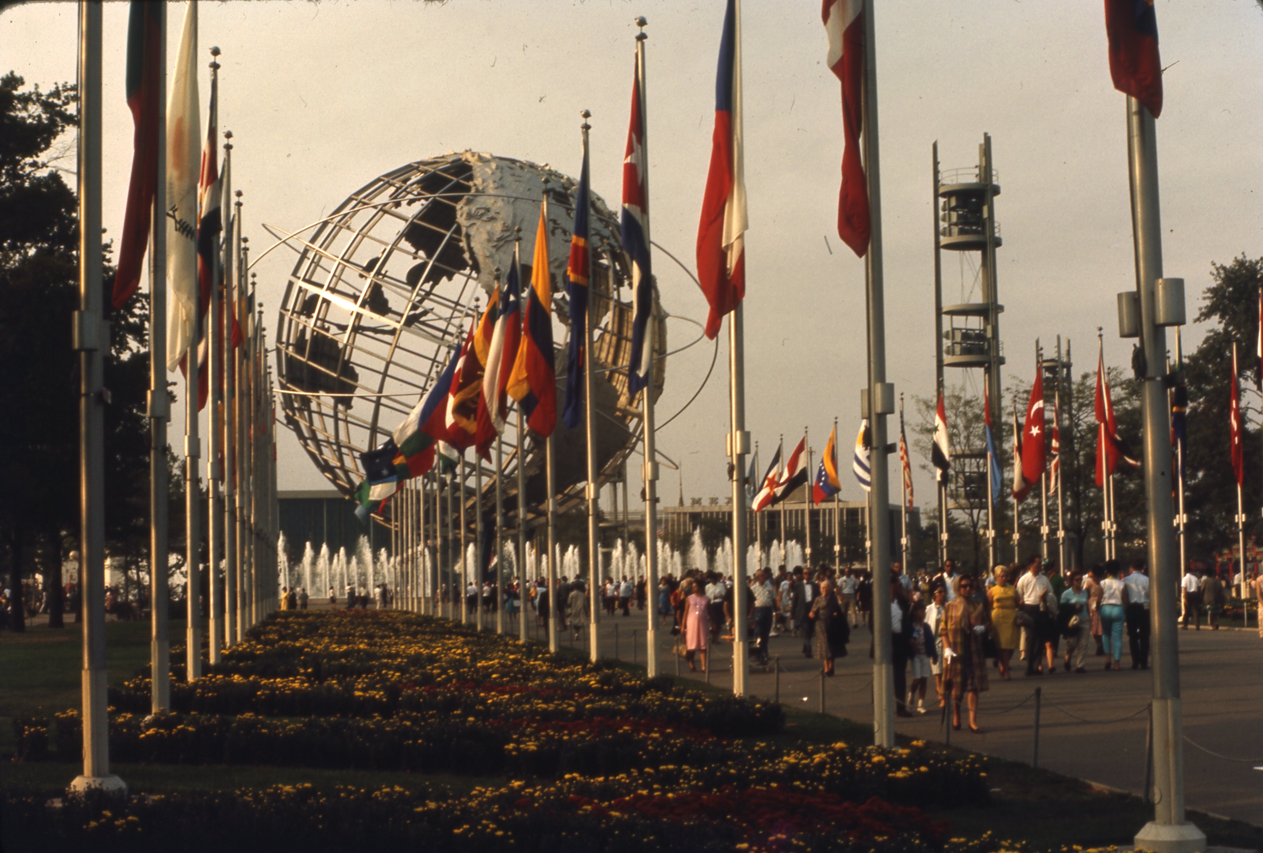 View of the Unisphere in 1965 with world flags in the foreground.