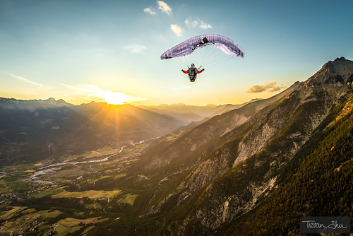 High up in the air, the Alps, a sunset and a full stall glider with Jean Baptiste Chandelier