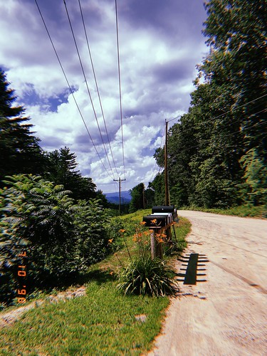 hujicam retro filter app trees powerlines road dirtroad street nh newhampshire newengland newhampton newhamptonnewhampshire newhamptonnh mailbox mailboxes clouds bushes summer july northeast