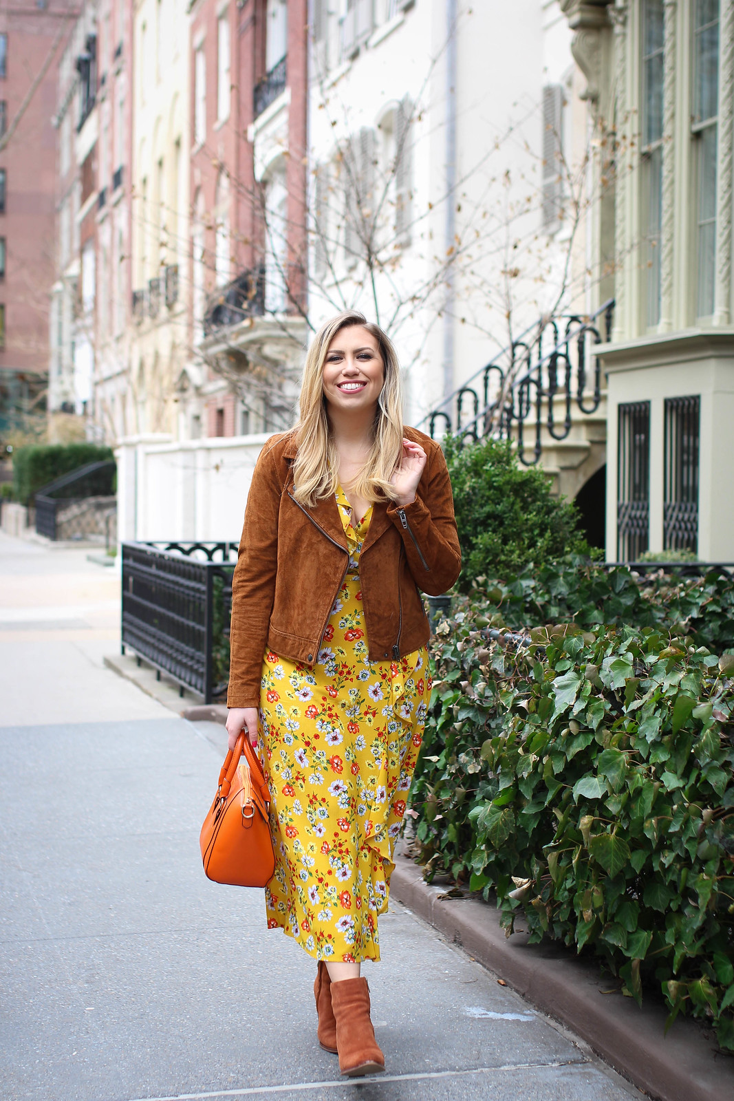 Yellow Floral Maxi Wrap Dress Suede Moto Jacket Orange Bag Suede Booties Spring in NY Outfit Inspiration Fashion Blogger Jackie Giardina