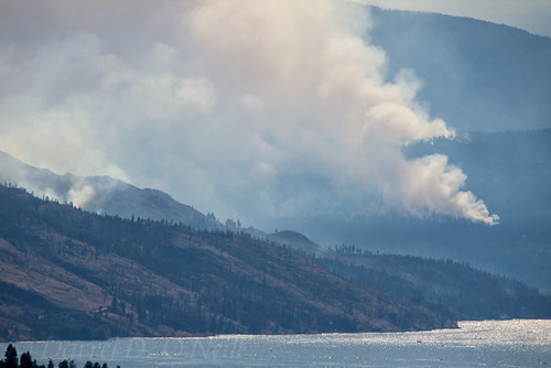landscape scenic water lake mountains hills smoke forestfire wildfire forest fire burning valley okanagan kelowna bc canada blue green white grey gray