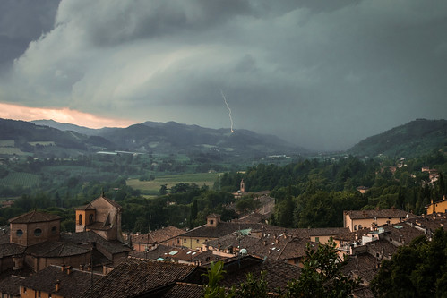 storm brisighella italy italia emiliaromagna village town landscape sky clouds church buildings houses lightning weather europe country countryside mountains trees vegetation field ravenna