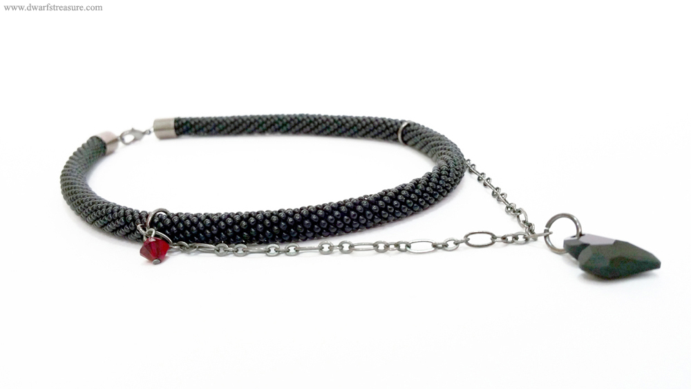Adorable jet beaded crochet short necklace with red swarovski bead