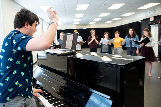 Jason Belanger works with the students on 'The Song of Purple Summer.'