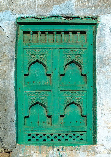 abandoned arabia arabianpeninsula arabic arabicarchitecture arabicstyle architecture buildingexterior carved carvedwindow carvingcraftproduct colorimage day decrepit dhofar dhufar exteriorview facade ghosttown green gulfcountries habitation history house houseexterior mirbat moscha nopeople old oldhouse oman oman18202 outdoors sultanate thepast traveldestination traveldestinations vertical weathered window woodenwindow dhofargovernorate om