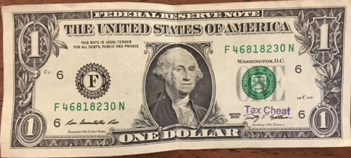 Tax Cheat stamp on $1 bill