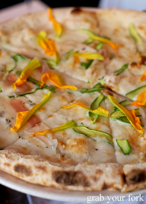 Pizza bianco with zucchini flowers and lardo at La Rosa The Strand in Sydney