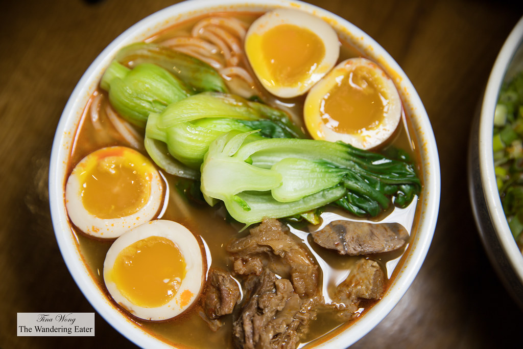 Braised Beef Noodles Soup with extra soft boiled smoked egg - Braised beef flank cooked with chili bean paste, star anise and Sichuan style spices, topped with baby bok choy and scallions