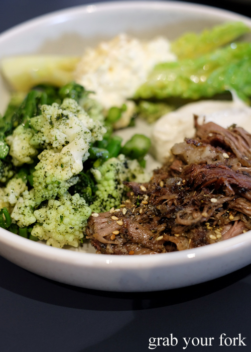 Roasted lamb shoulder with broccolini and romanesco green cauliflower and baby gem lettuce salad at A1 Canteen by Clayton Wells in Chippendale Sydney