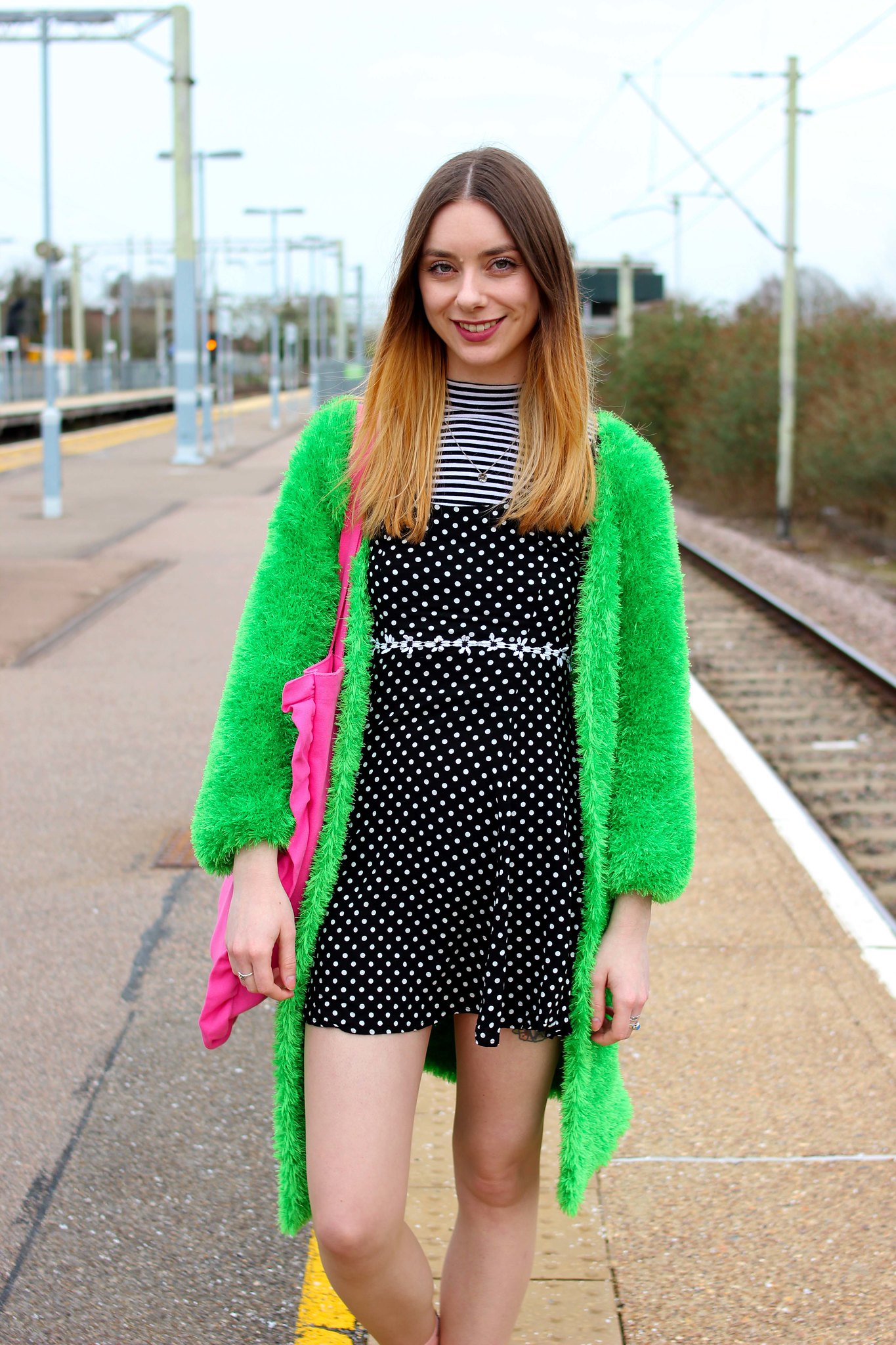 Clashing spots and stripes with a bright green cardigan