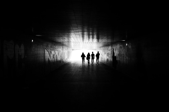 Bystanders approaching the light