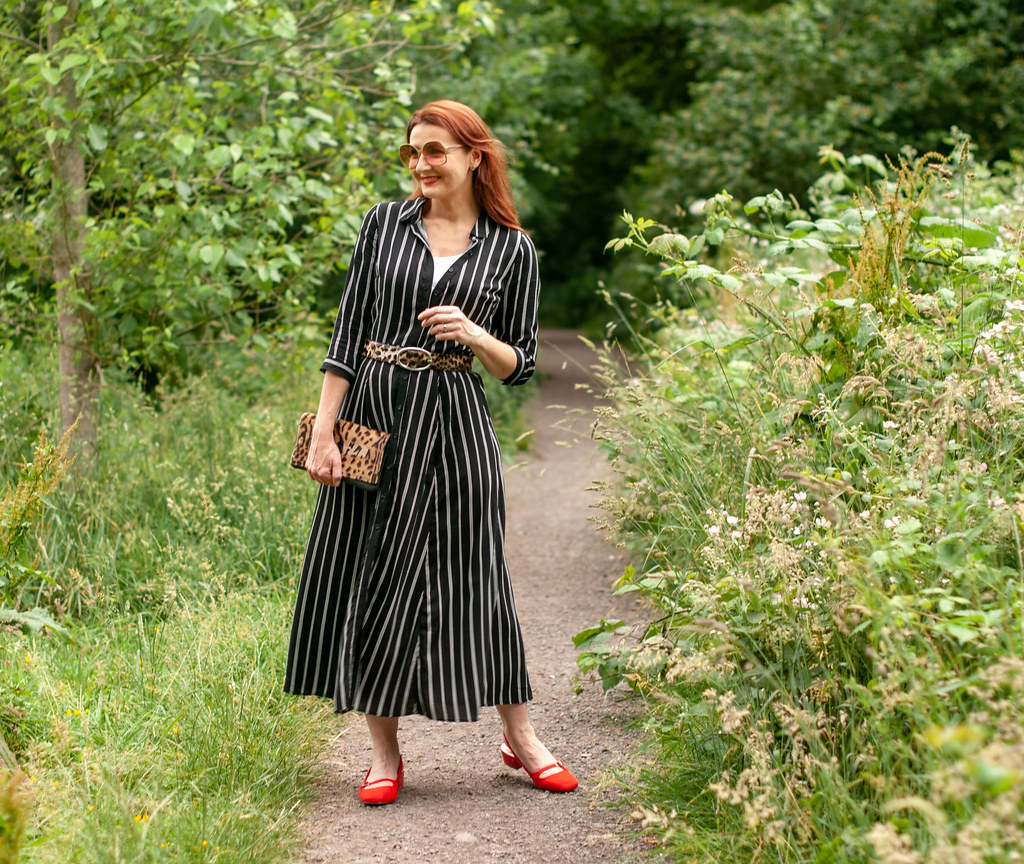 How to Style a Summer Shirt Dress With Pattern Mixing \ black and white striped midi shirt dress \ leopard clutch and belt \ red slingback block heel shoes | Not Dressed As Lamb, over 40 style