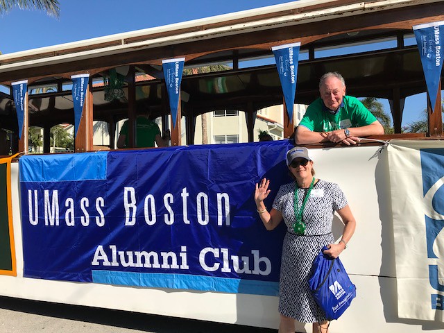 UMass Alumni Banner & Patrons on Trolley