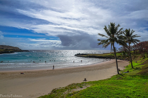 travel chile polynesia rapanui easterisland anakena sky cloud beach sand tree grass ocean water wave bay people