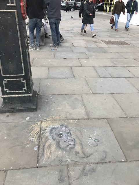 monkey drawing on the sidewalk,  London